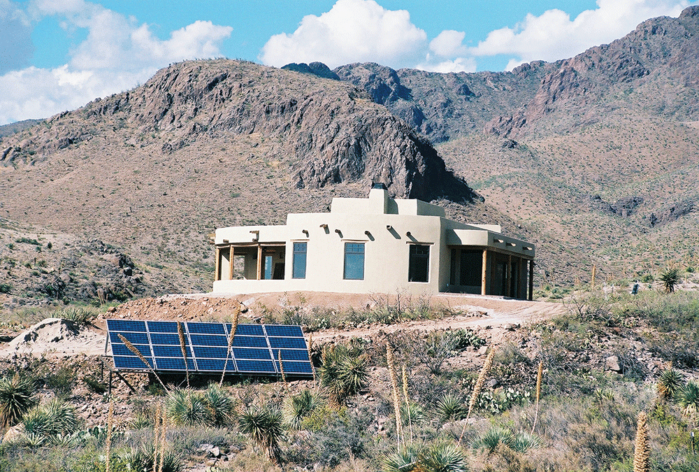 Photo 5. Stand-alone, off-grid PV system includes battery bank and back-up generator (not shown). Courtesy of John Wiles