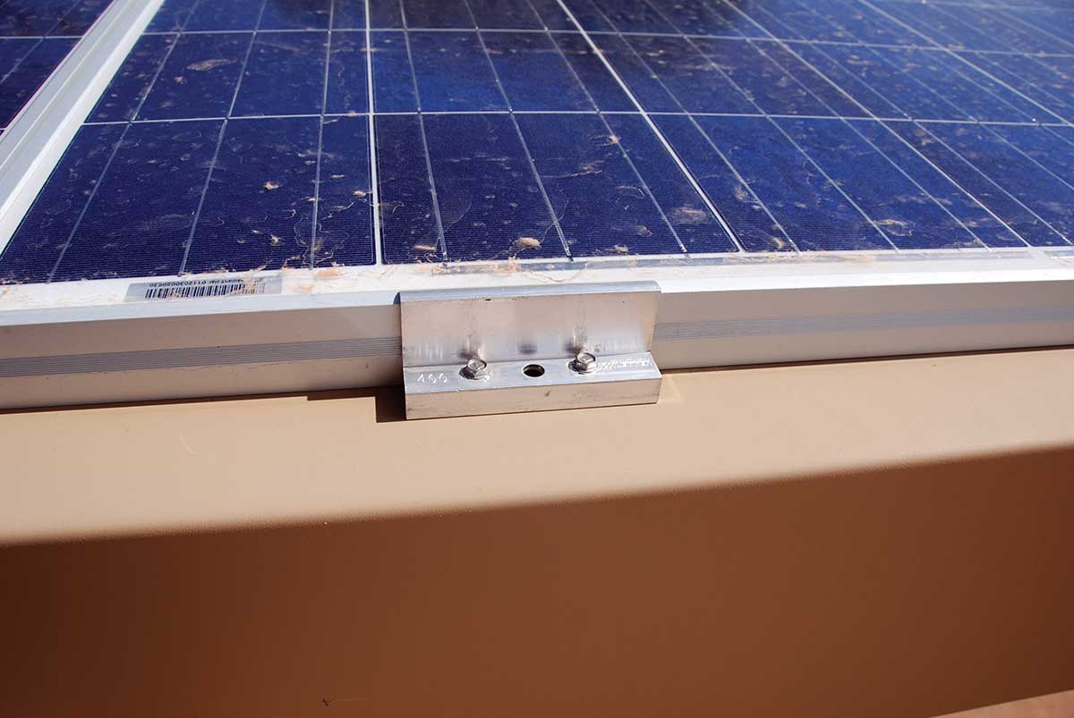 Photo 1. Module clamping device field-modified from one hole to two holes, violating the device listing. Photo by John Wiles.