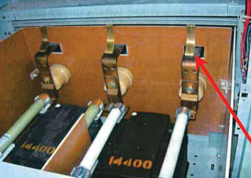Photo 10. Medium voltage draw-out type switch with ground straps.