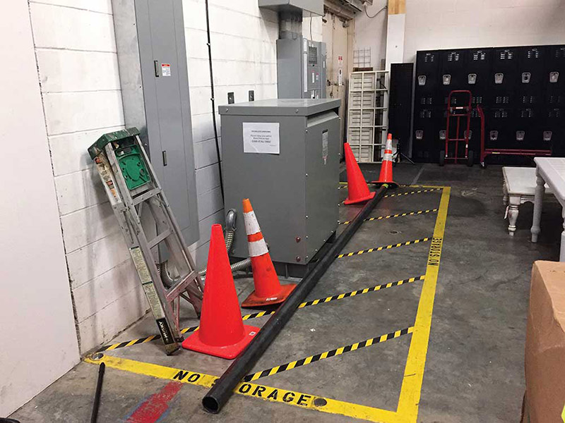 Photo 4. Floor marking of the working space (clear space) and items placed in this area.