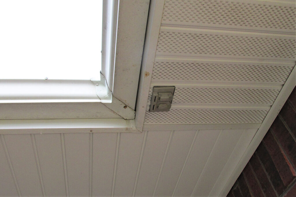 Photo 1c. This installation requires the AHJ to make a determination as to a damp or wet location. In this case, the location was determined to be damp.