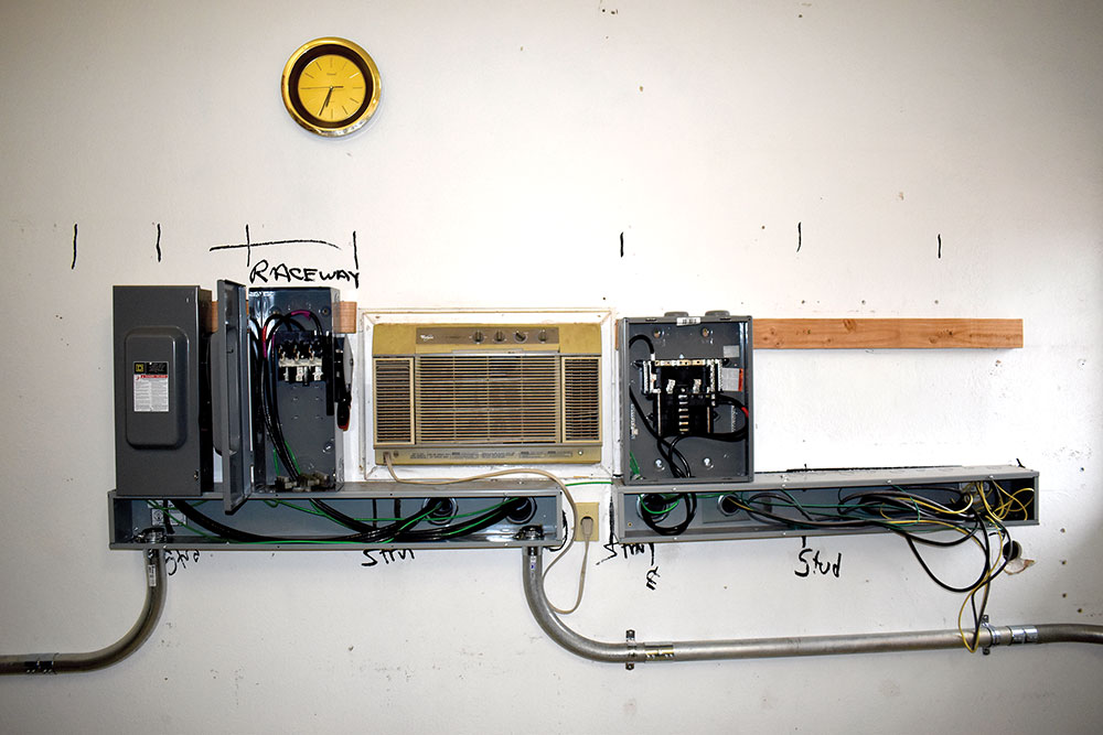 Photo 4. Metal raceways being installed. DC circuits on the left, AC and comm circuits on the right. Courtesy of John Wiles