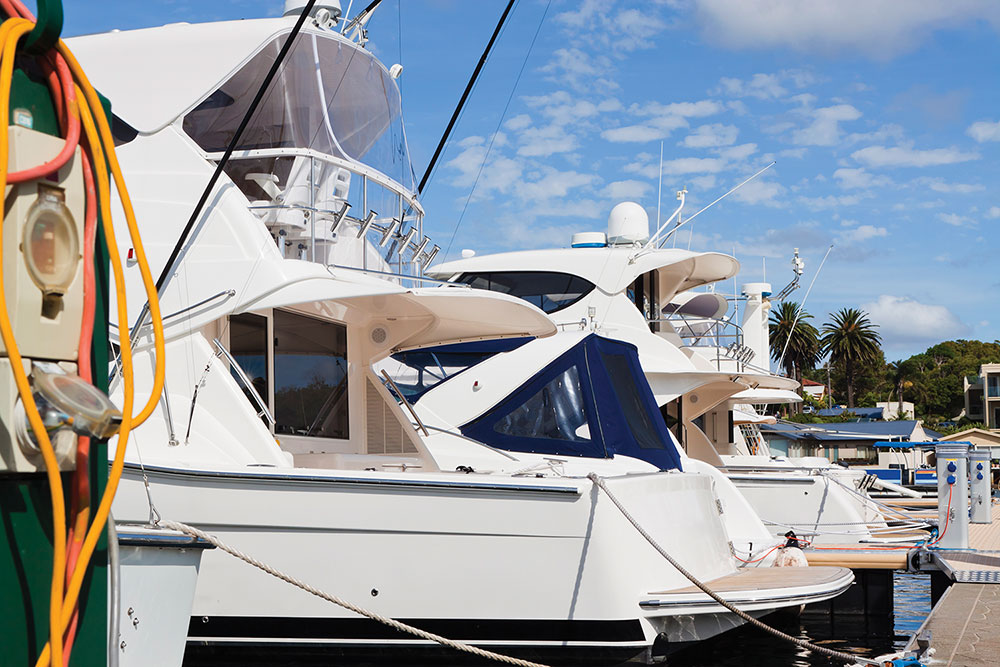 Photo 2. Boats docked in an aging infrastructure of marinas obtain power from the shore. Conductors between shore equipment and the boat are frequently found in disrepair. The wiring on the boat itself can be in disrepair. This and all damage can create a hazard for the entire dock.