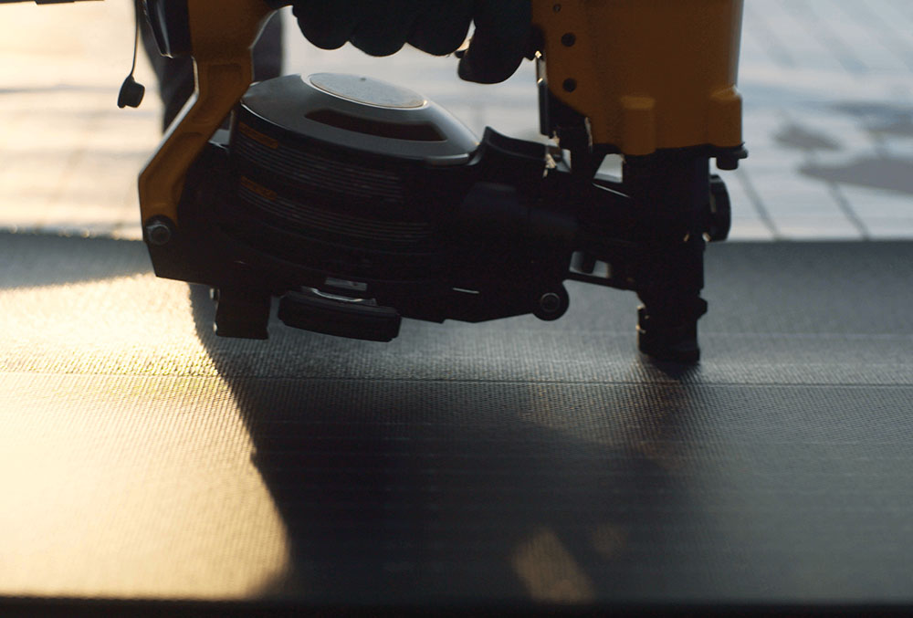 Solar shingles can be easily installed using typical asphalt shingle roofing practices and equipment. Image copyright GAF Energy